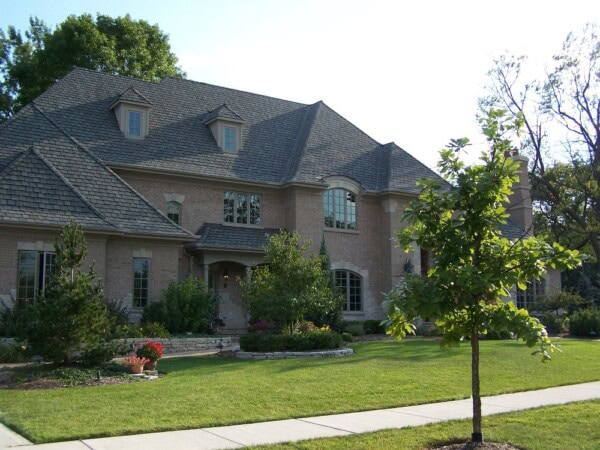 Residential home featuring a Grand Manor roof by Tilden Roofing